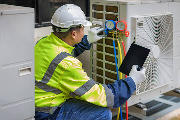 Professional Air Conditioning Repair technician working in Rumford, RI